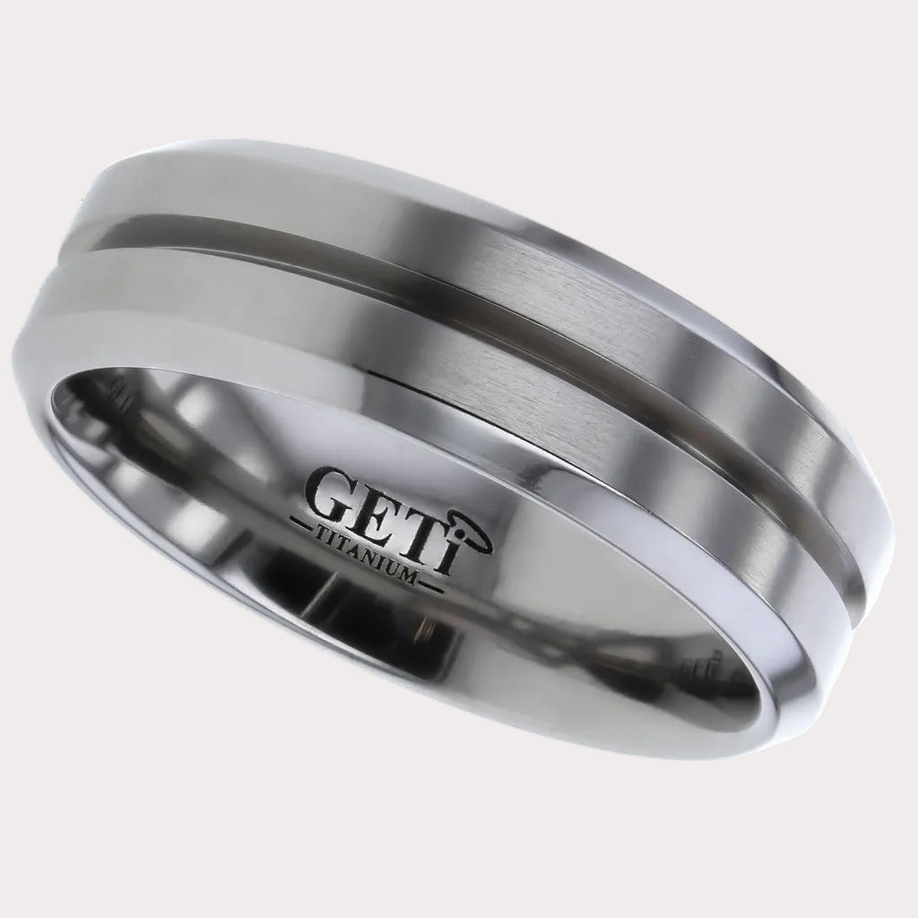 Flat profile Titanium ring with chamfered edges and central 'V' groove.