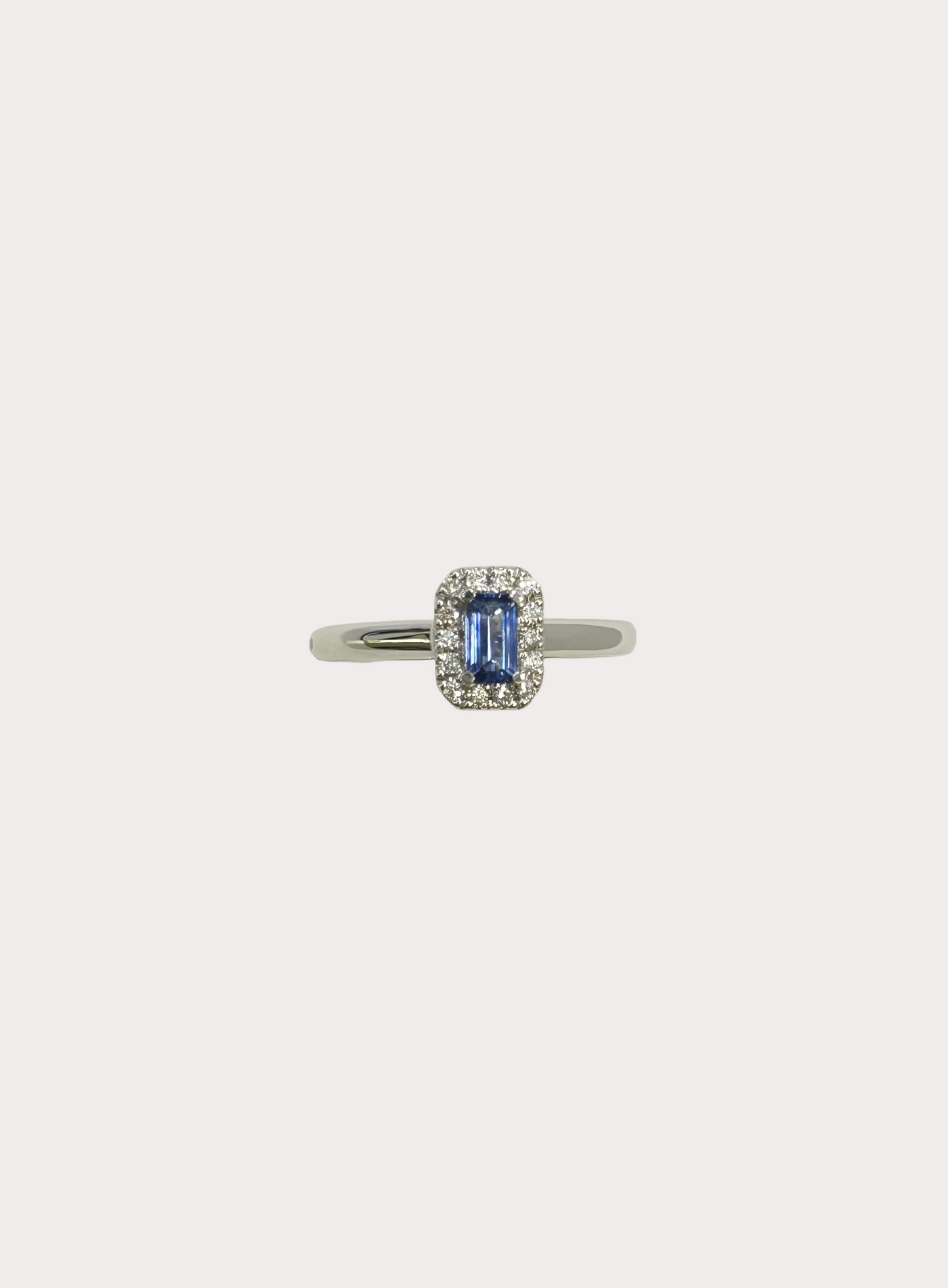 18ct White Gold Emerald Cut Sapphire and Diamond Halo