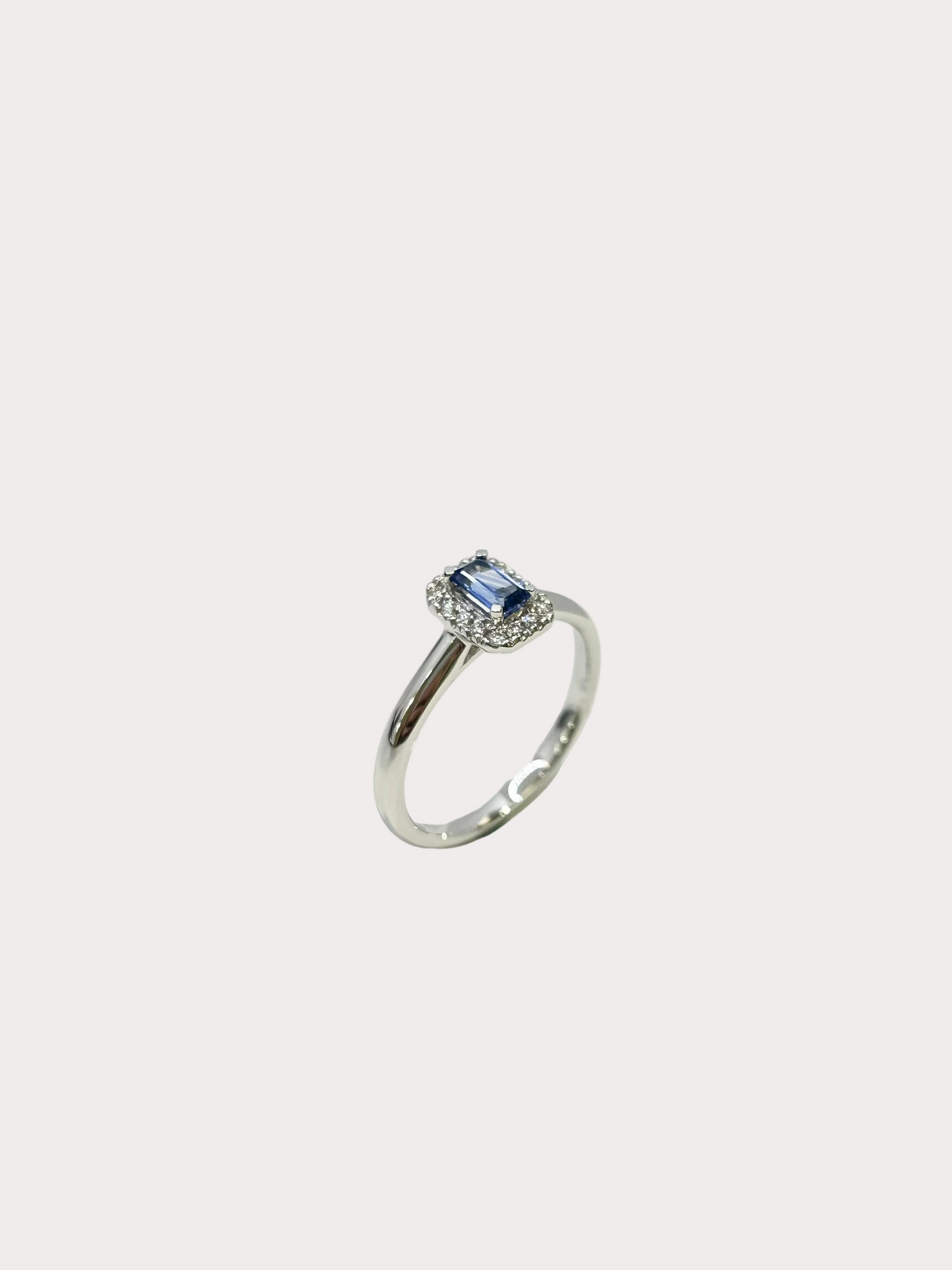 18ct White Gold Emerald Cut Sapphire and Diamond Halo